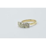 18ct White and yellow gold four claw diamond trilogy ring, the diamonds approximately 3.40ct