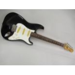 Squier Stratocaster made in Korea and finished in black, together with a hard case