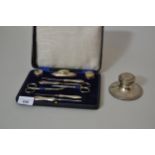 Cased silver handled manicure set and a silver capstan inkwell