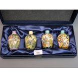 Boxed set of four ' Seasons ' small modern Moorcroft baluster form vases with typical stylised