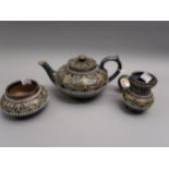 Late 19th Century Doulton Lambeth stoneware three piece tea service with typical stylised floral