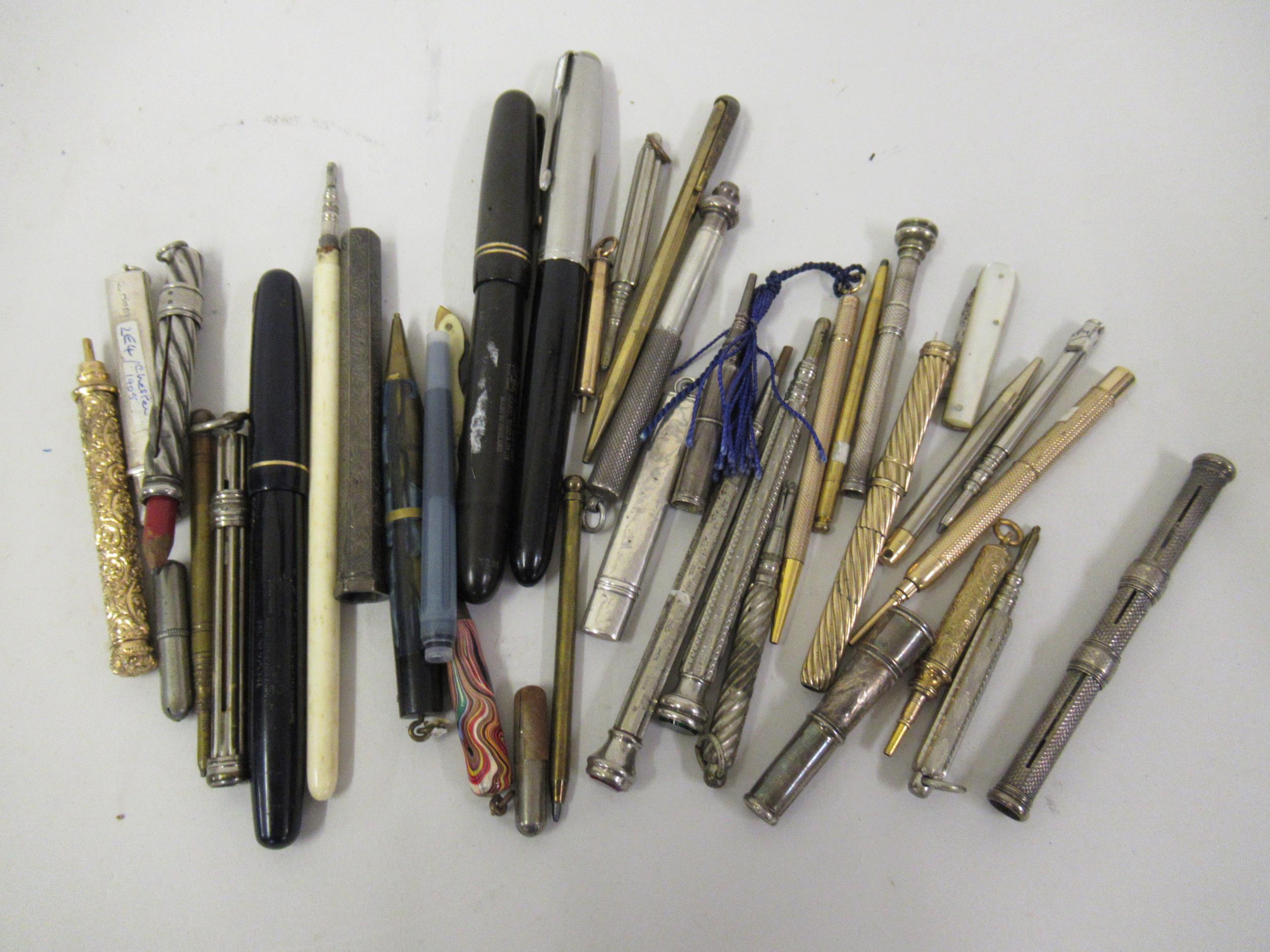 Collection of silver gilt metal and other propelling pencils, fountain pens etc. Two hallmarked