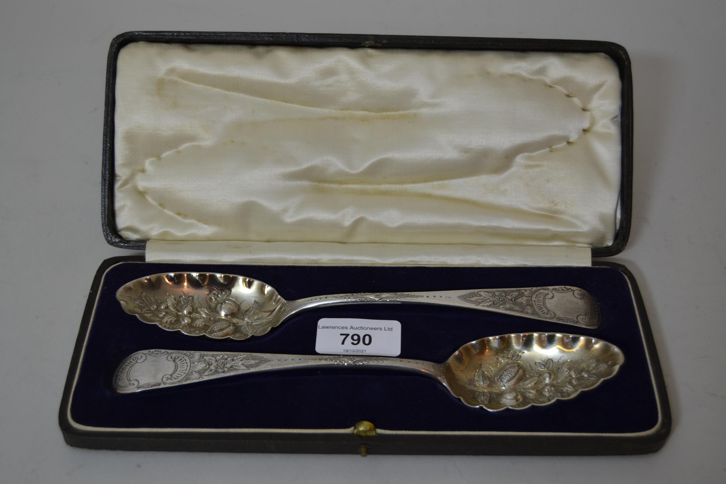 Cased pair of silver berry spoons with embossed decoration, hallmarked London 1780, maker Thomas
