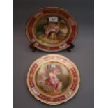 Pair of 19th Century Vienna wall plates painted with classical scenes within gilded borders, 9.