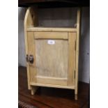 Small pine single door wall cabinet and a bookcase section with single glazed door