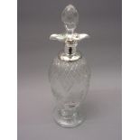 Silver mounted cut glass decanter with stopper