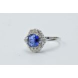 18ct White gold oval tanzanite and diamond cluster ring, the tanzanite approximately 1.13ct Ring