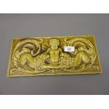 Late 19th Century Mintons rectangular pottery plaque relief moulded with a cherub and two lions,
