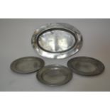 Antique oval pewter plate together with three circular pewter plates