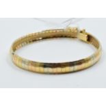 18ct Three colour gold bracelet of articulated design, 20g