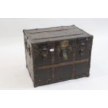 Late 19th Century canvas covered trunk, having cast iron mounts and wooden slatted, bearing a plaque