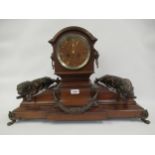 Early 20th Century mahogany mantel clock of architectural form, the broken arch top above a wooden