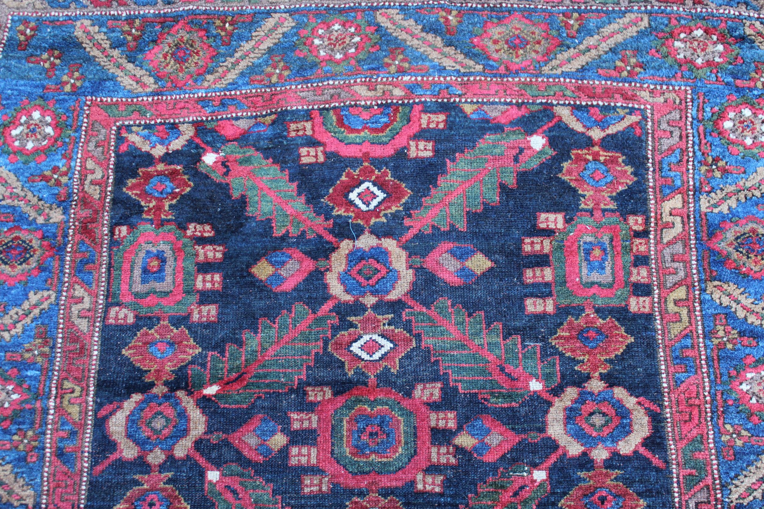 Antique Kurdish rug, having all over stylised floral design, midnight ground with multiple - Image 2 of 3