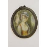 19th Century oval watercolour, portrait miniature of a lady, in a brass frame (at fault)