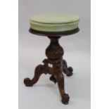 Victorian circular adjustable piano stool on carved walnut tripod support Good condition, no