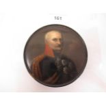 19th Century black lacquer papier mache circular snuff box, the lid painted with a portrait of a