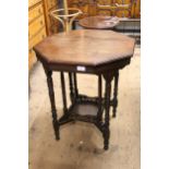 Late Victorian octagonal walnut two tier occasional table on eight turned supports