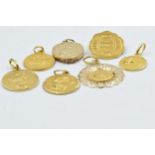 Four various 18ct gold charms, 11.5g together with three various others, unmarked, 5.5g