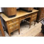 Edwardian mahogany and line inlaid twin pedestal desk of seven drawers, raised on low square