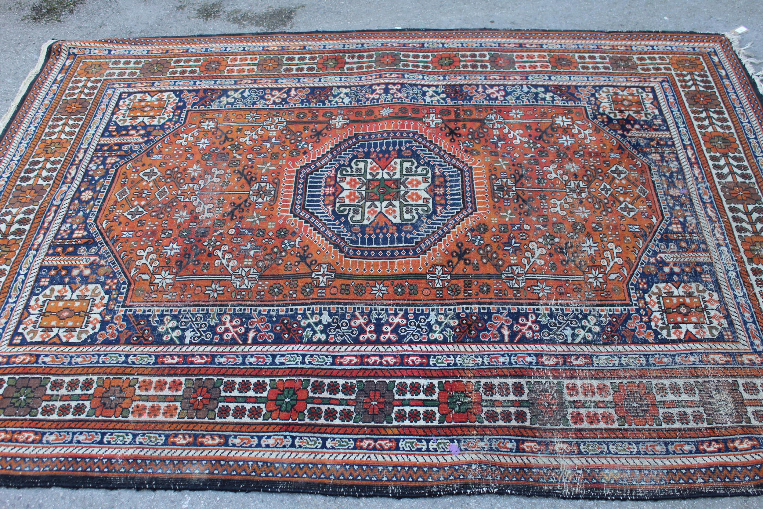 Qashqai rug of central floral medallion and all-over floral design with border, approximately