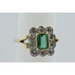 18ct Yellow gold ring set emerald surrounded by brilliant cut diamonds Updated Weight - 4g Ring Size
