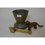 Middle Eastern brass scribes box, together with a brass jardiniere on stand and a metal dog form nut