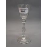 18th Century drinking glass, the tapering bowl above a double knopped stem and circular folded foot,