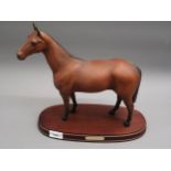 Royal Doulton figure of Arkle, mounted on an oval wooden base, with original box