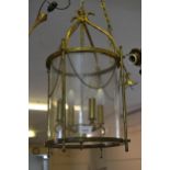 20th Century large brass hanging lantern with glass shade together with a French circular bed canopy