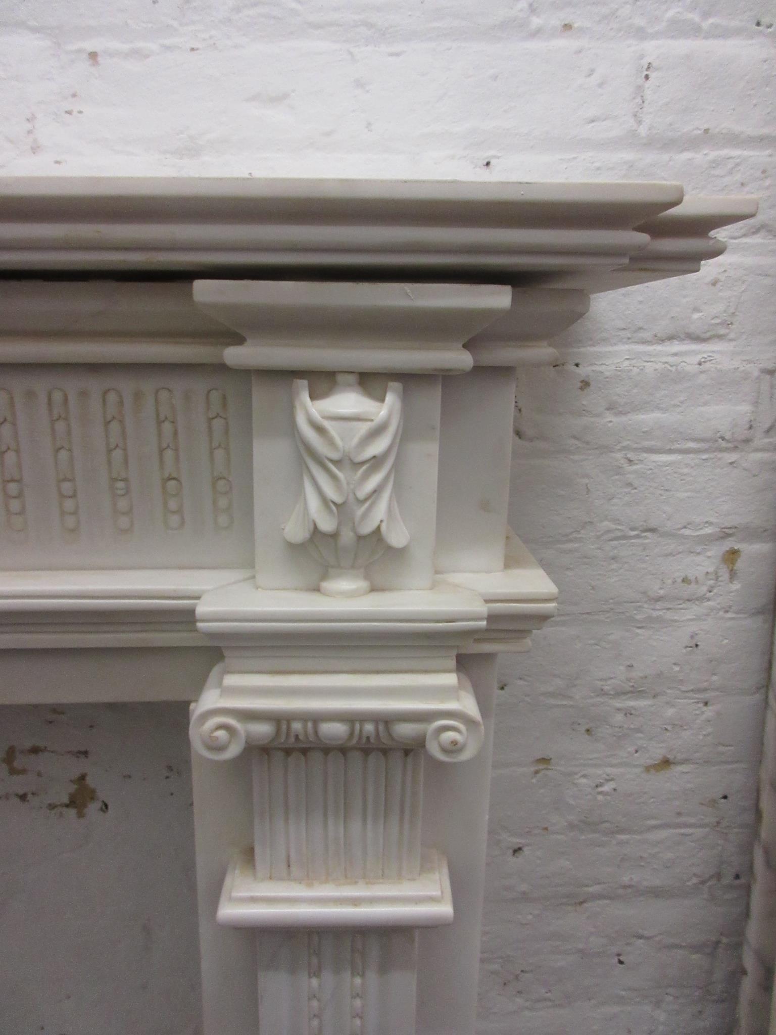 Large white marble fire surround having a moulded mantelpiece, above a central urn with bows and - Image 4 of 12