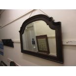 20th Century mahogany framed wall mirror, having shaped arched top and reeded sides and bevelled