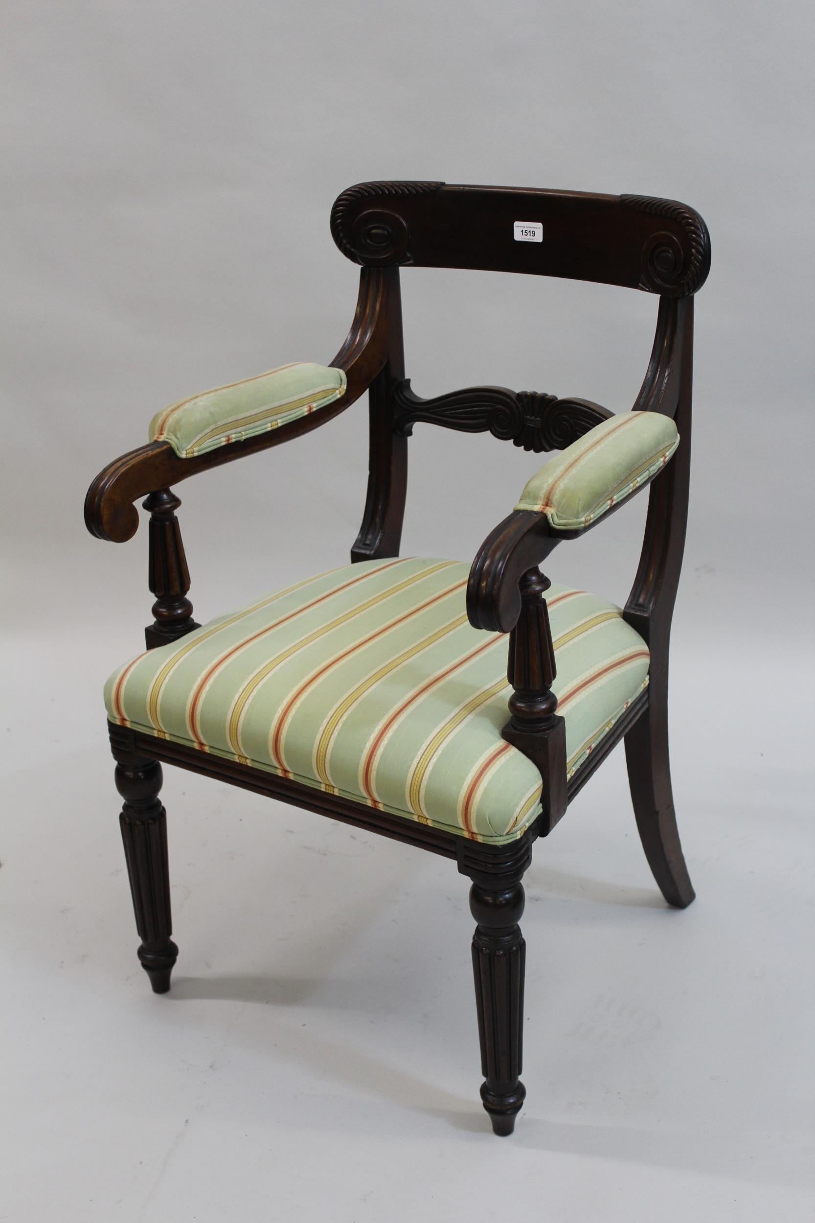 William IV mahogany open armchair, the carved and moulded rail back above moulded and padded arms,