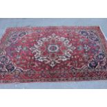 Bakhtiari rug with centre medallion and all-over floral design with border (worn), approximately