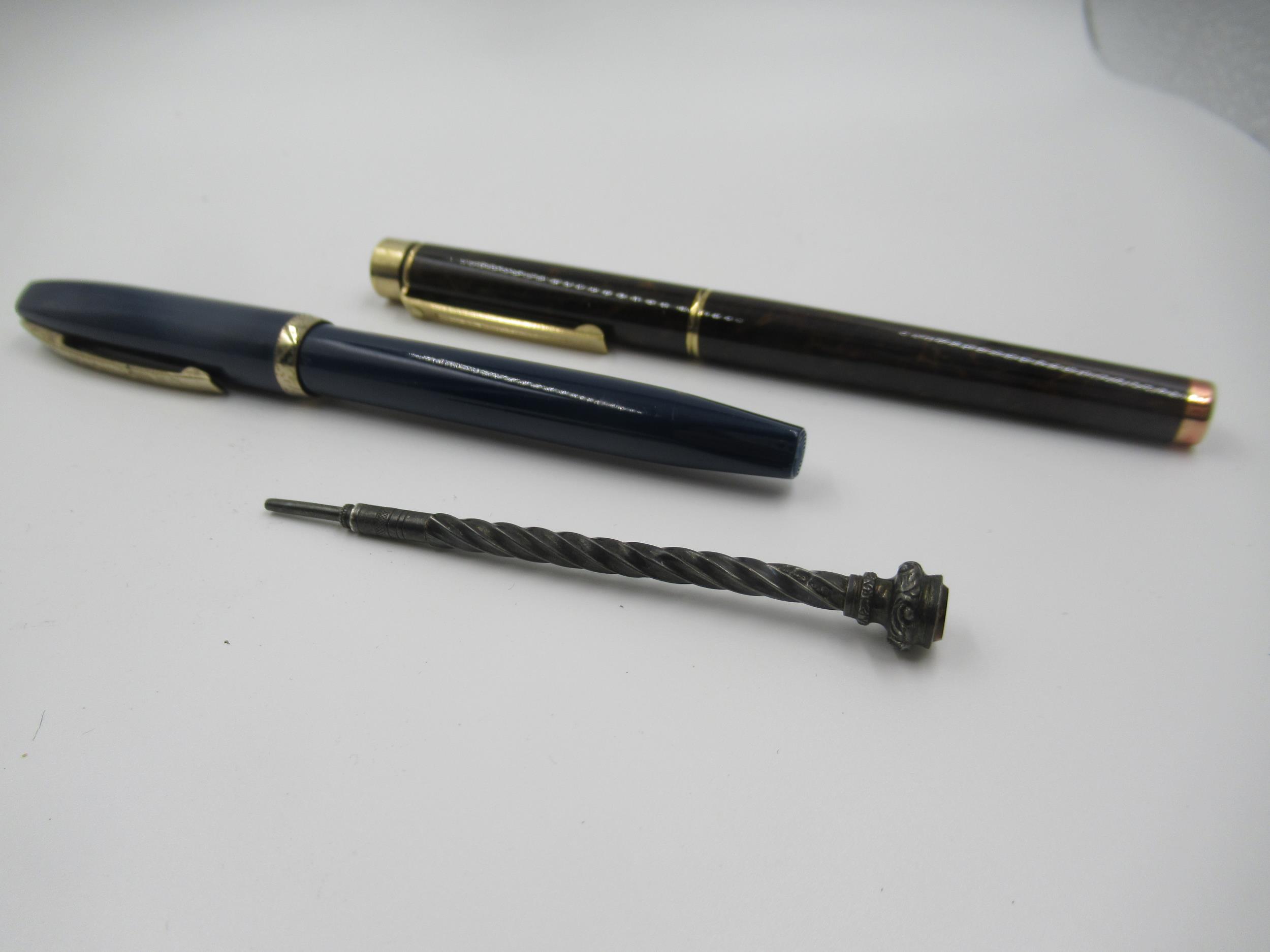 Two Sheaffer fountain pens with 14ct gold nibs, together with a small silver propelling pencil