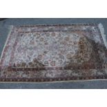 Indo Persian rug of all-over floral and bird design with multiple borders on a beige ground,