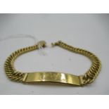 An unmarked Middle Eastern yellow metal identity bracelet with curb link design, 18.5g Not