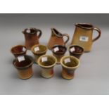 Muchelney Pottery (John Leach), three small salt glazed stoneware jugs, the tallest 5ins high