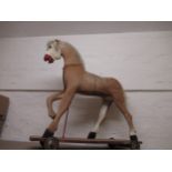 Children's pony skin covered pull-a-long toy horse, 31ins high x 29ins wide