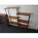 Mid 20th Century teak and ebonised wooden shelving system of six open shelves, raised on turned