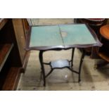 Small Edwardian mahogany card table, the shaped fold-over top above cabriole supports and undertier,