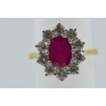 18ct Yellow gold oval ruby and diamond cluster ring, the ruby approximately 2.25ct, the diamonds