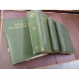 Two large green Ideal postage stamp albums containing an extensive collection of World stamps,
