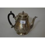 Victorian silver teapot with chased floral decoration and ebonised handle, London 1874, 24.5oz