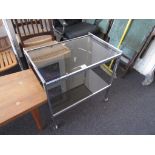 1970's Rectangular chrome and smoke glass two tier drinks trolley by Howard Miller MDA, 25ins wide x