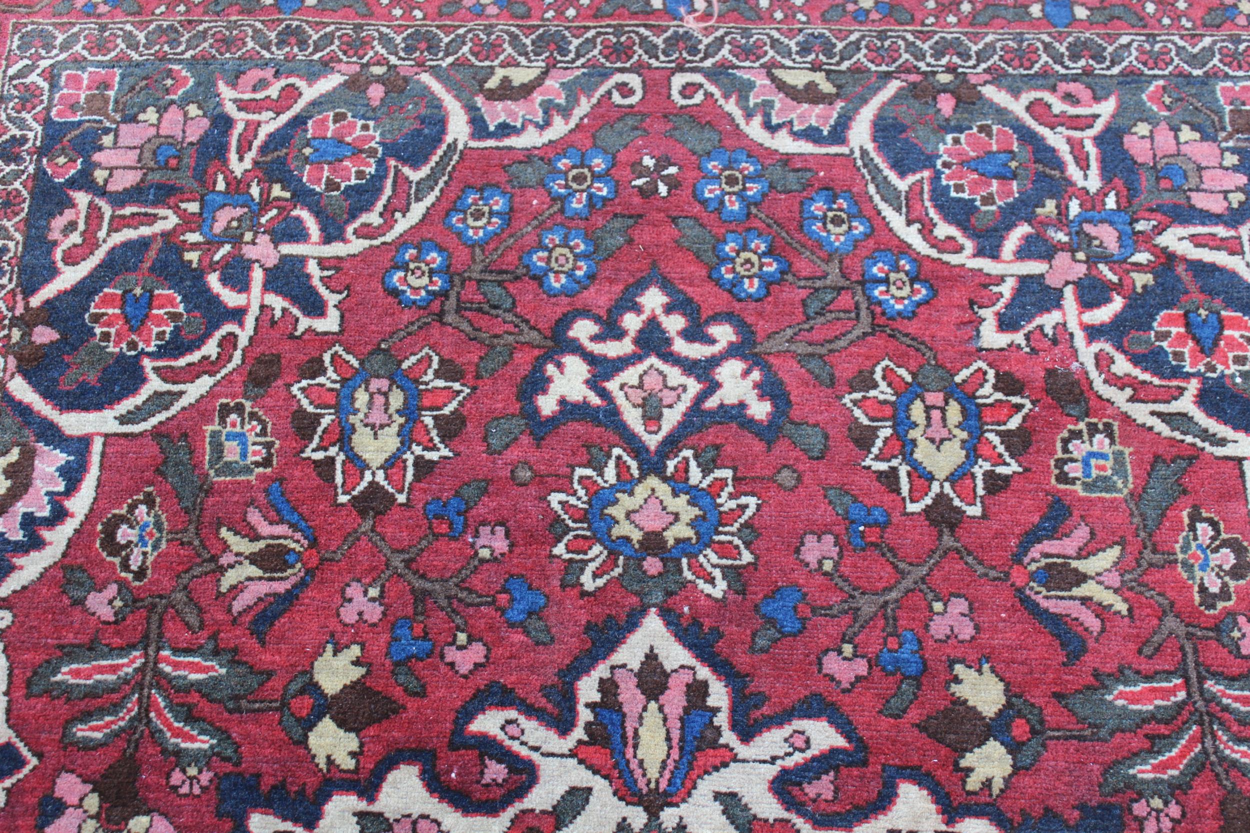 Bakhtiari rug with centre medallion and all-over floral design with border (worn), approximately - Image 2 of 4