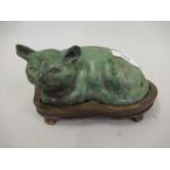 Modern oriental green patinated bronze figure of a cat, on a hardwood base, 6ins wide approximately