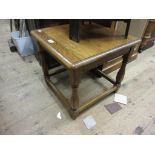 20th Century square oak table on baluster turned supports with peripheral stretchers, 18.5ins high x