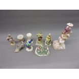 Continental porcelain figural candlestick (at fault) together with two items of Capo di Monte and