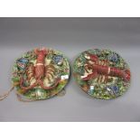 Pair of 20th Century Portuguese Palissy type wall plates, relief moulded with lobsters, 12in