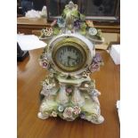 Small Continental porcelain cherub mounted mantel clock (at fault)